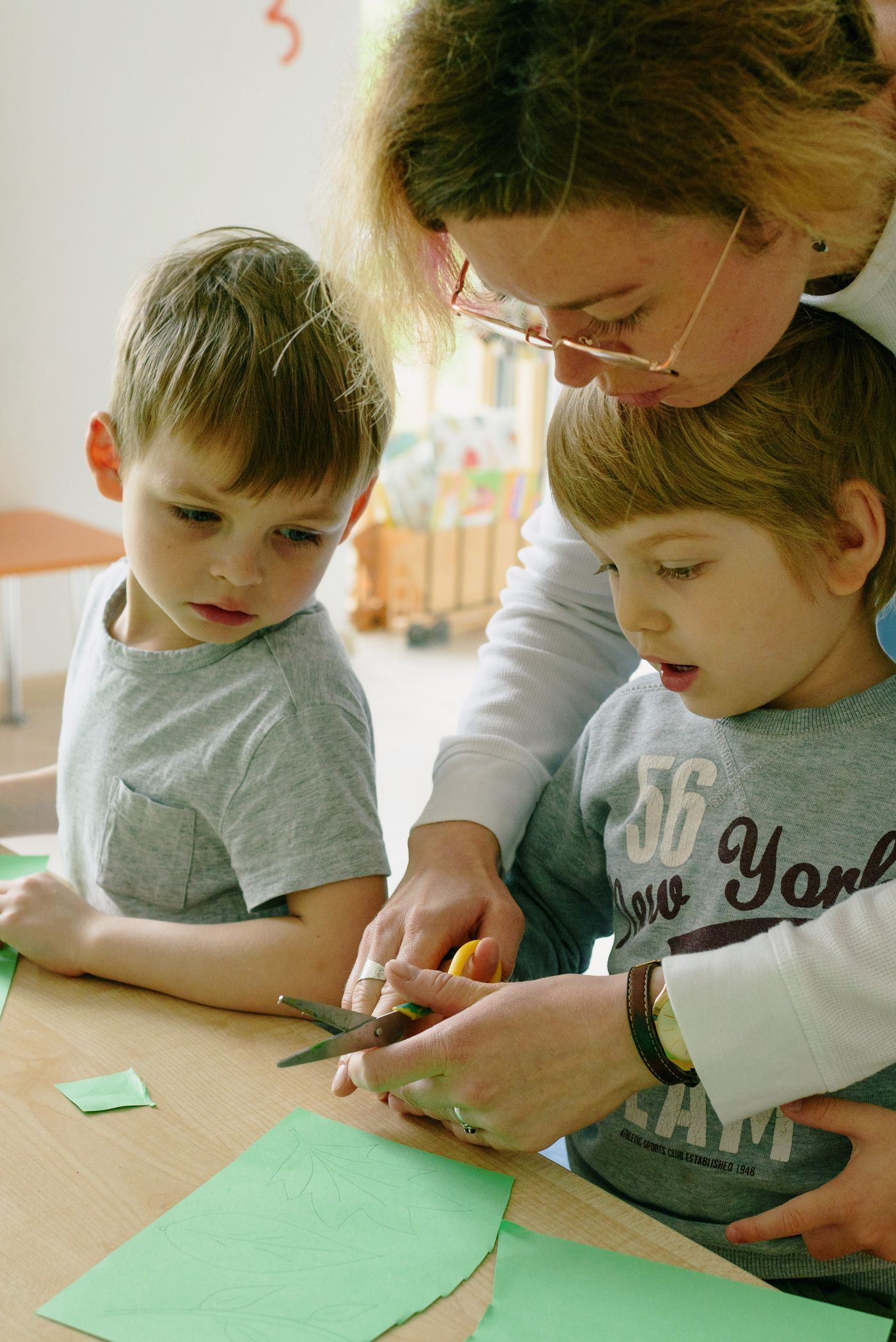 Two young children playing and learning together